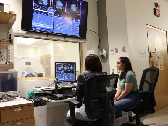 University of Arizona post-doc and graduate student working on the MRI machine computer
